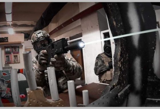 a guy shooting through a window
